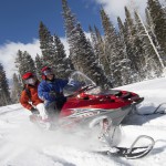 couple snowmobiling